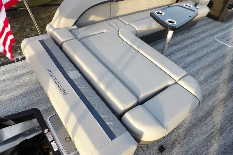 Slide: The Image of 2026 Bennington M Swingback 22 MSB boat interior with plush seating and cupholders. - 35