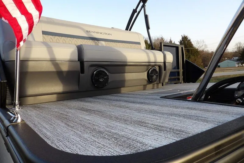 Slide: The Image of 2026 Bennington M Swingback 22 MSB pontoon boat with stylish seating and American flag. - 37