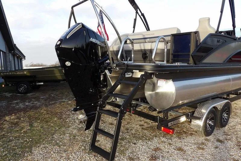 Slide: The Image of 2026 Bennington M Swingback 22 MSB pontoon boat with Mercury outboard motor and trailer. - 43