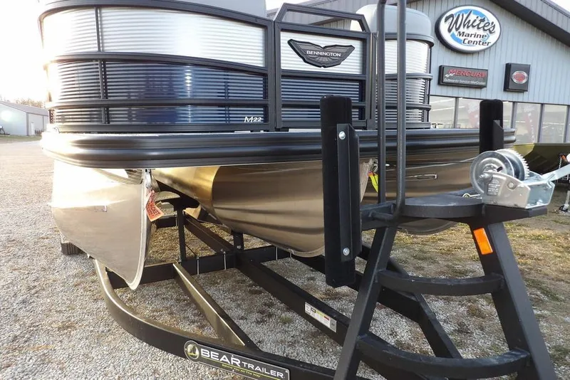 Slide: The Image of 2026 Bennington M Swingback 22 MSB pontoon boat on a trailer at White's Marine Center. - 46