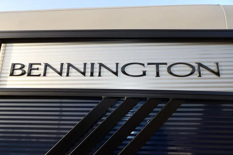 Slide: The Image of Bennington logo on 2026 M Swingback 22 MSB boat, sleek design. - 47