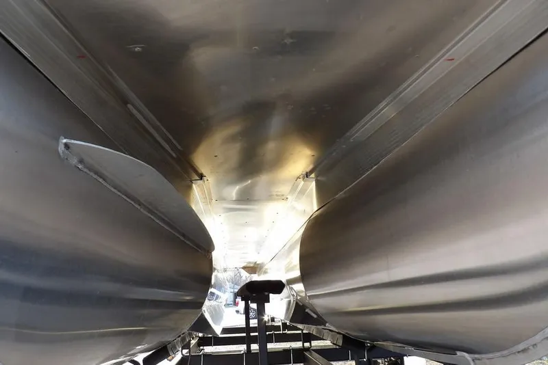 Slide: The Image of Underneath view of 2026 Bennington M Swingback 22 MSB pontoon boat on trailer. - 51