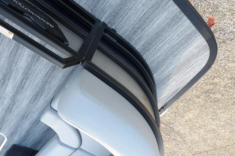 Slide: The Image of 2026 Bennington M Swingback 22 MSB boat interior with sleek seating and flooring design. - 9