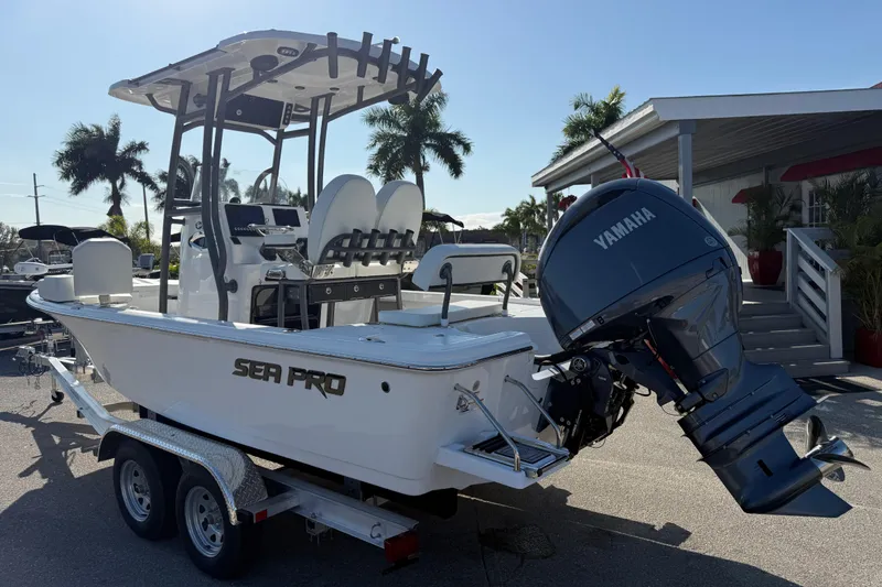 Slide: The Image of 2025 Sea Pro 210 Bay boat with cushioned seating and trolling motor. - 11