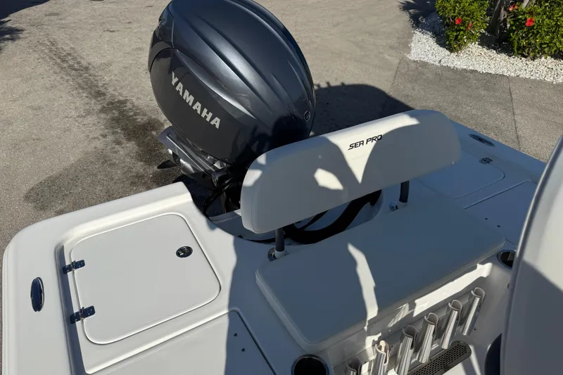 Slide: The Image of 2025 Sea Pro 210 Bay boat interior with Yamaha engine and dual captain's chairs. - 12
