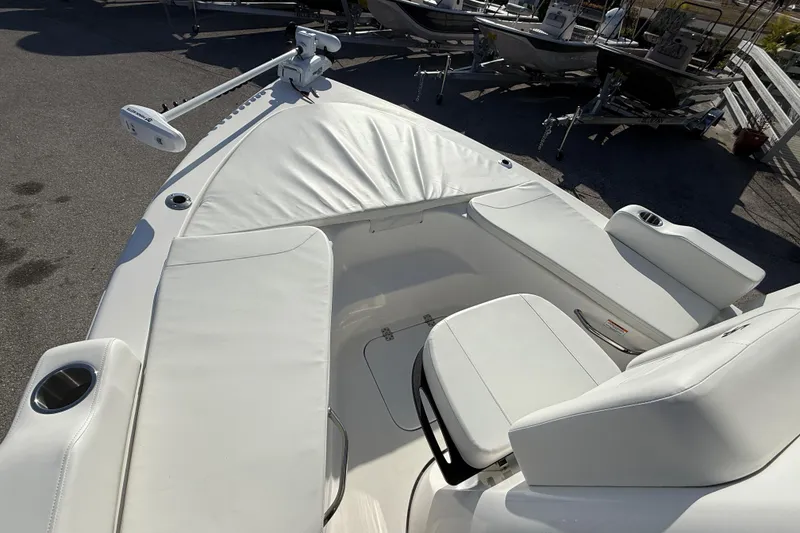 Slide: The Image of 2025 Sea Pro 210 Bay boat interior with white seating and sleek design. - 21