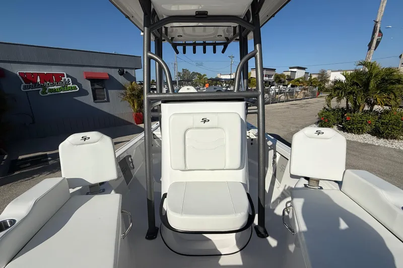 Slide: The Image of Interior view of 2025 Sea Pro 210 Bay boat, showcasing wiring and equipment. - 23