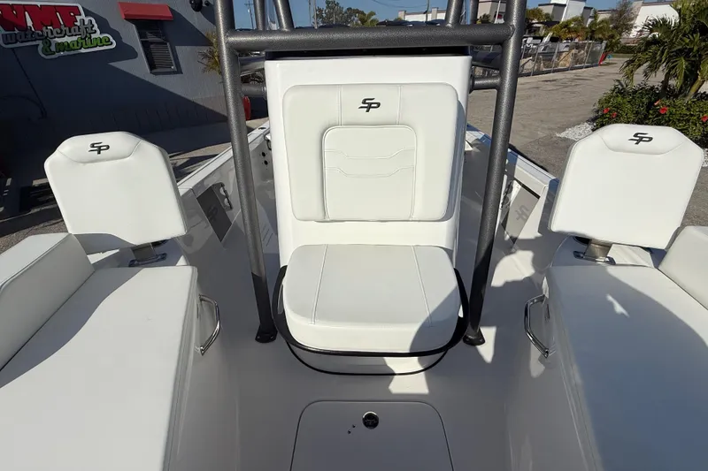 Slide: The Image of 2025 Sea Pro 210 Bay boat console with steering wheel and navigation controls. - 24