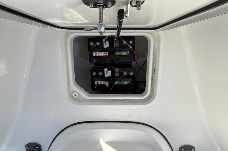 Slide: The Image of Open storage compartment on 2025 Sea Pro 210 Bay boat, showing interior details. - 25