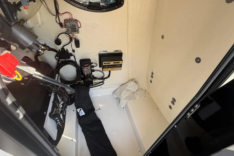 Slide: The Image of 2025 Sea Pro 210 Bay boat interior with storage compartments and seating. - 26