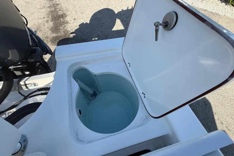 Slide: The Image of 2025 Sea Pro 210 Bay boat interior detail with logo and latch. - 28