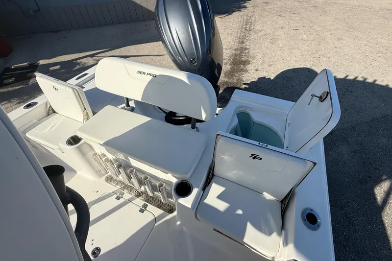 Slide: The Image of 2025 Sea Pro 210 Bay boat interior with storage compartments and sturdy seating. - 29
