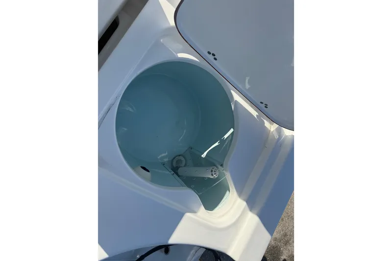 Slide: The Image of 2025 Sea Pro 210 Bay boat interior detail with storage compartment. - 30