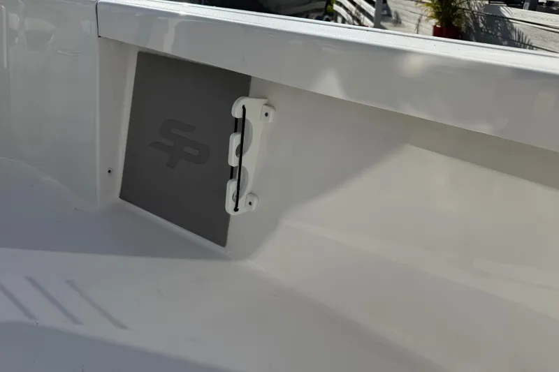 Slide: The Image of 2025 Sea Pro 210 Bay boat emblem and chrome detail in sunlight. - 31