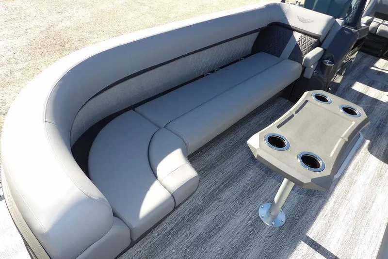 Slide: The Image of 2026 Bennington M Swingback 26 MSB boat interior with gray seating and table. - 11