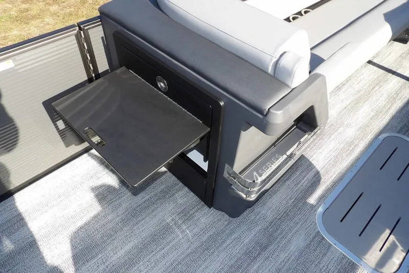 Slide: The Image of 2026 Bennington M Swingback 26 MSB boat interior with storage compartment open. - 18