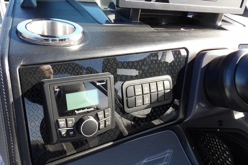 Slide: The Image of Dashboard of 2026 Bennington M Swingback 26 MSB with control panel and cup holder. - 22