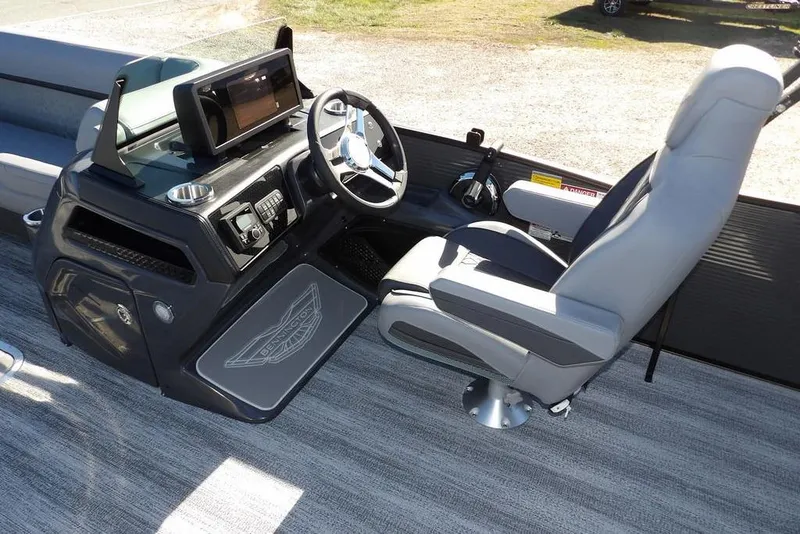 Slide: The Image of 2026 Bennington M Swingback 26 MSB boat interior with modern helm and captain's chair. - 23