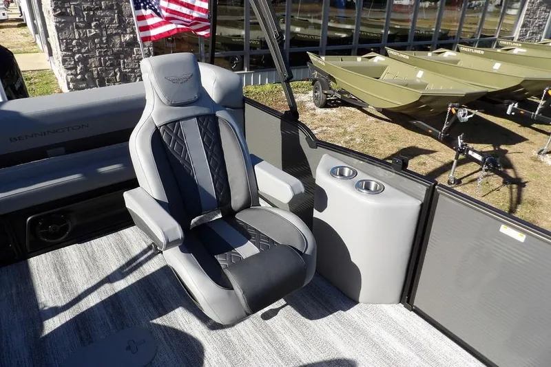 Slide: The Image of Luxurious seating on 2026 Bennington M Swingback 26 MSB pontoon boat with cup holders. - 24