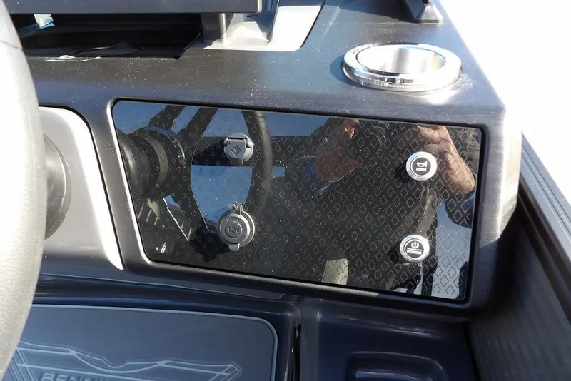 Slide: The Image of Dashboard of 2026 Bennington M Swingback 26 MSB with control buttons and cup holder. - 28