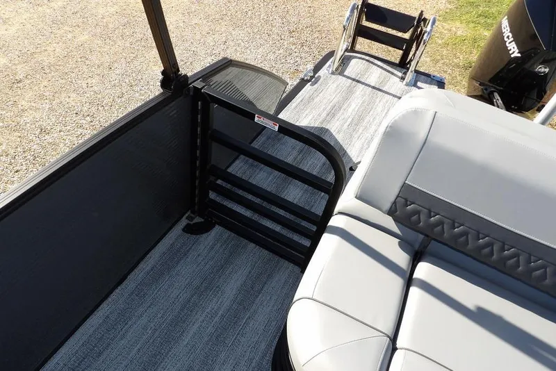 Slide: The Image of 2026 Bennington M Swingback 26 MSB boat interior with seating and flooring details. - 33