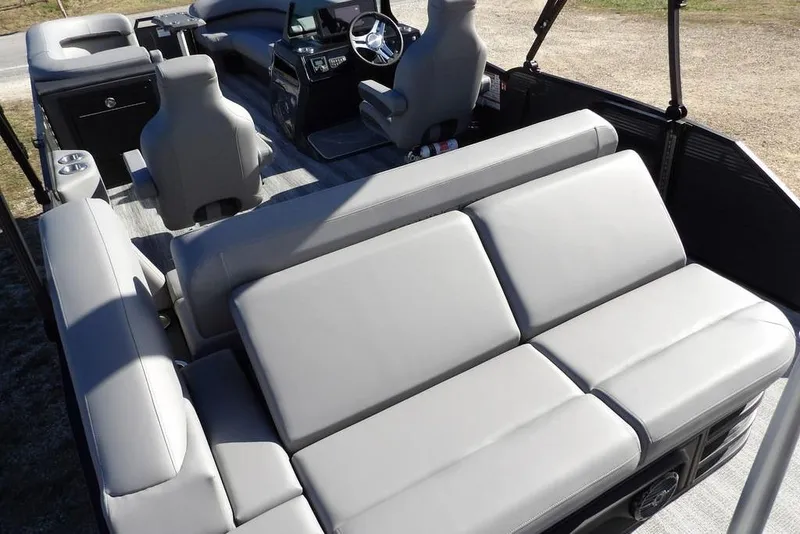 Slide: The Image of 2026 Bennington M Swingback 26 MSB pontoon boat interior with gray seating and helm. - 37