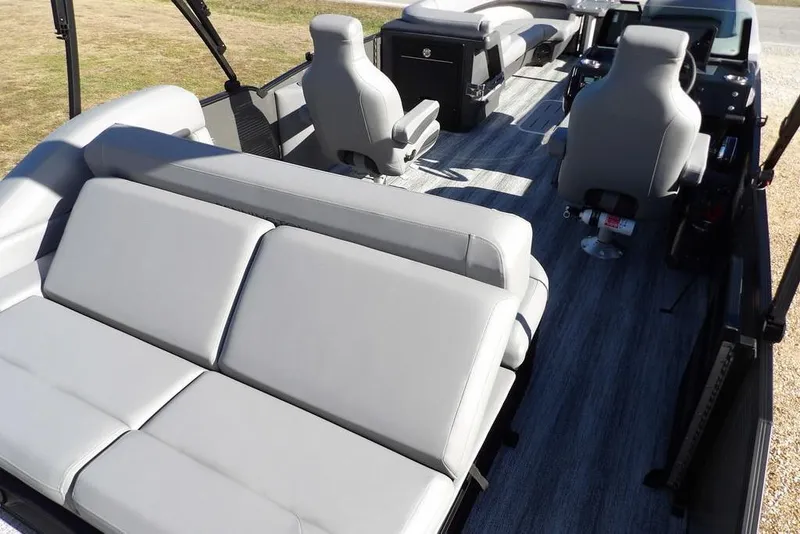 Slide: The Image of 2026 Bennington M Swingback 26 MSB pontoon boat interior with gray seating and modern design. - 39