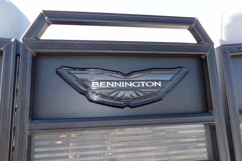 Slide: The Image of 2026 Bennington M Swingback 26 MSB logo on sleek boat panel. - 46