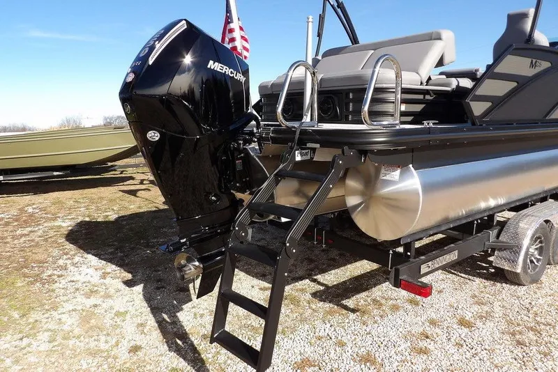 Slide: The Image of 2026 Bennington M Swingback 26 MSB pontoon boat with Mercury engine and ladder. - 47