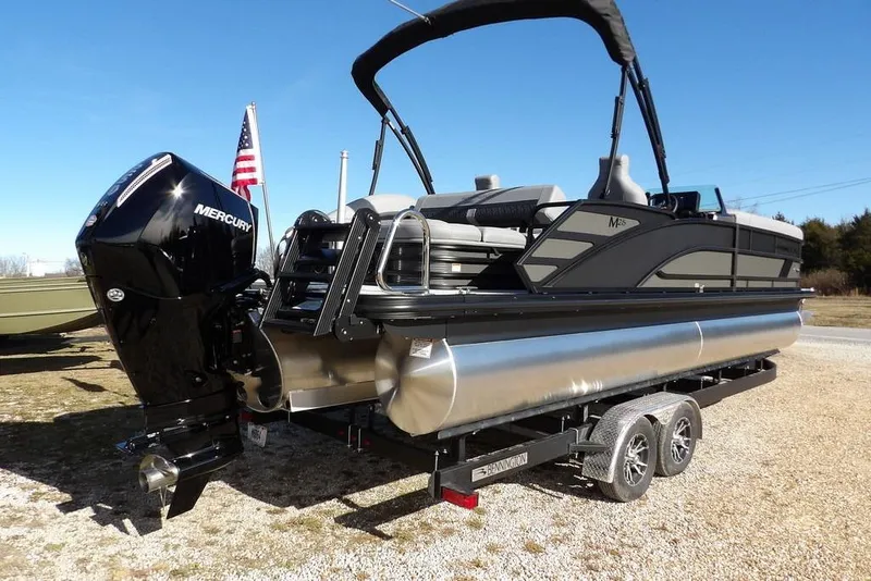 Slide: The Image of 2026 Bennington M Swingback 26 MSB pontoon boat on trailer with Mercury engine. - 7