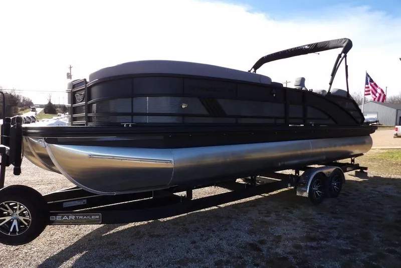 Slide: The Image of 2026 Bennington M Swingback 26 MSB pontoon boat on trailer, side view. - 9