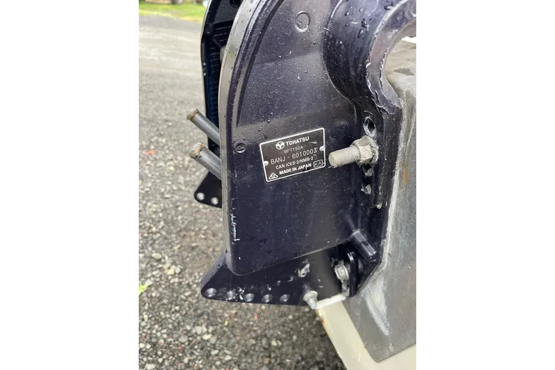 Slide: The Image of Close-up of a Tohatsu engine part on a 2004 Triumph 191 Fish & Ski boat. - 3