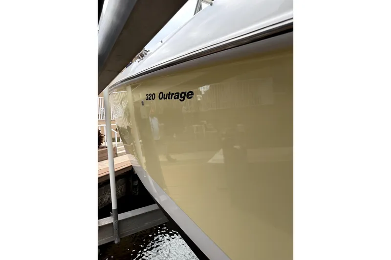 Slide: The Image of 2005 Boston Whaler 320 Outrage boat interior, featuring spacious seating and sleek design. - 10