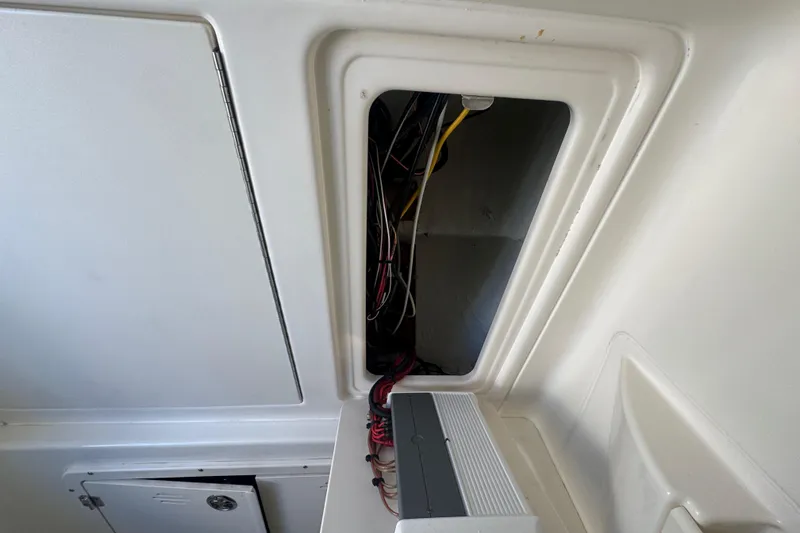 Slide: The Image of 2005 Boston Whaler 320 Outrage boat docked with twin 300 Verado engines. - 13