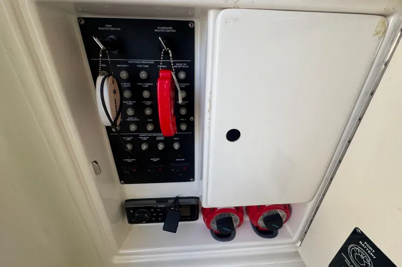 Slide: The Image of 2005 Boston Whaler 320 Outrage boat interior with seating and console. - 14