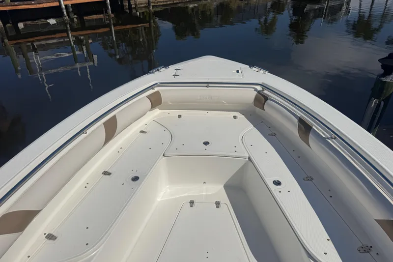 Slide: The Image of 2005 Boston Whaler 320 Outrage boat interior with open storage compartments. - 17
