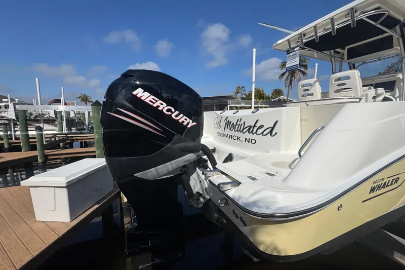 Slide: The Image of 2005 Boston Whaler 320 Outrage with twin Mercury 300 engines docked. - 22