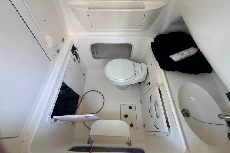 Slide: The Image of 2005 Boston Whaler 320 Outrage with Mercury engine docked under clear skies. - 23