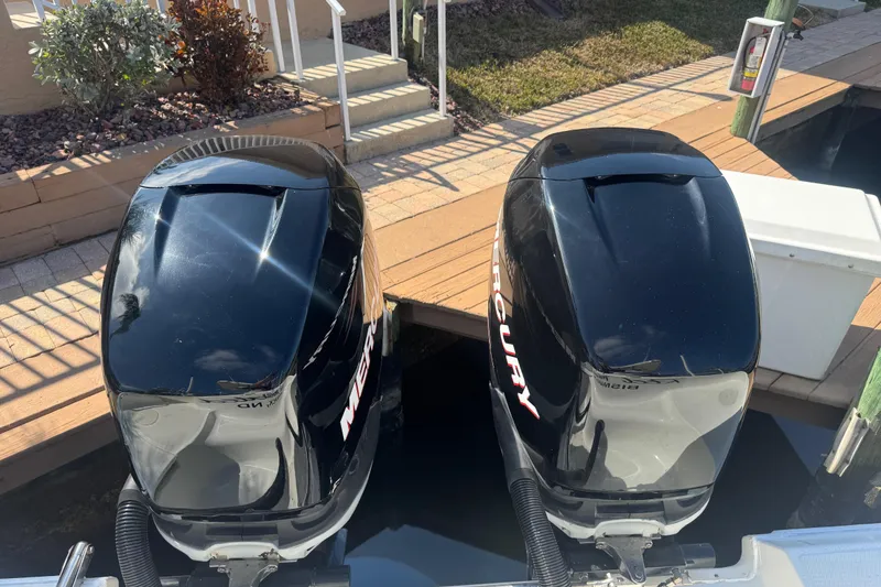 Slide: The Image of 2005 Boston Whaler 320 Outrage spotlight and radar on boat roof. - 26