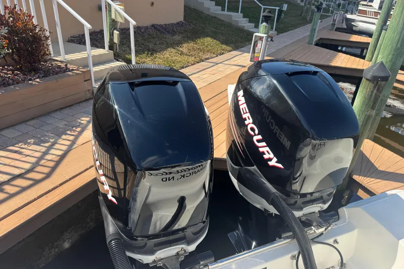 Slide: The Image of 2005 Boston Whaler 320 Outrage plumbing system with hoses and clamps. - 28