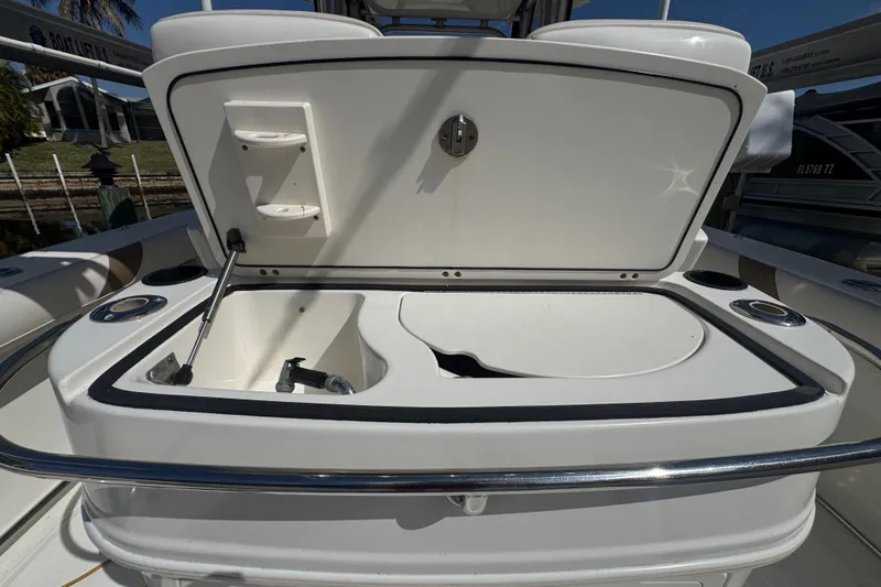 Slide: The Image of 2005 Boston Whaler 320 Outrage interior wiring compartment with visible cables and panel. - 30