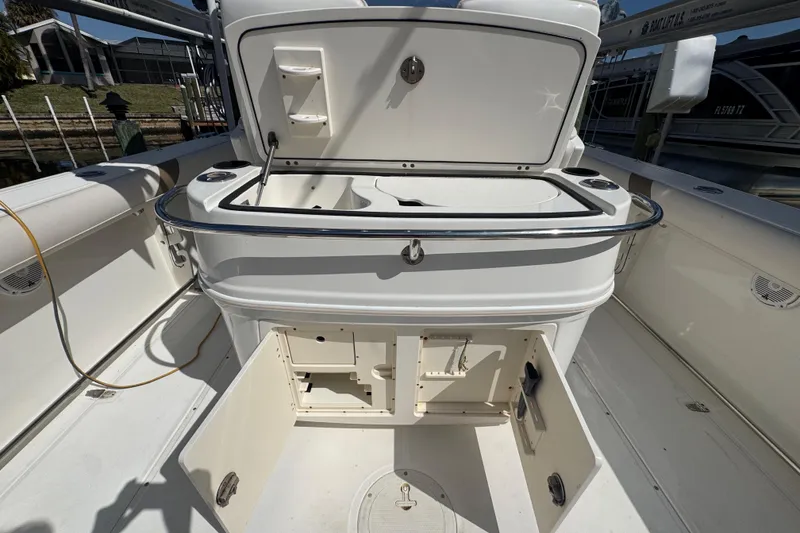 Slide: The Image of Control panel of a 2005 Boston Whaler 320 Outrage boat with switches and dials. - 31