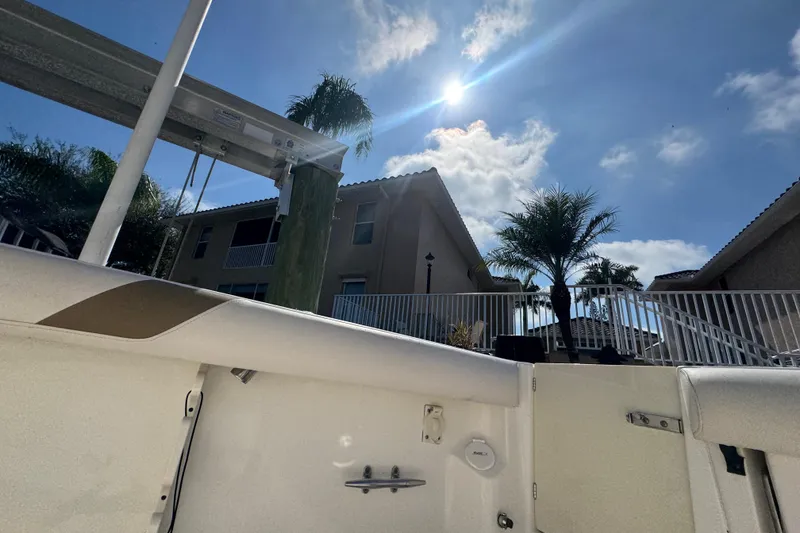 Slide: The Image of Control panel of a 2005 Boston Whaler 320 Outrage boat with switches and dials. - 32