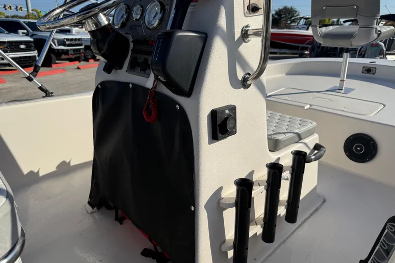 Slide: The Image of Interior of 2026 Carolina Skiff E18 JVX CC boat with steering console and seating. - 17