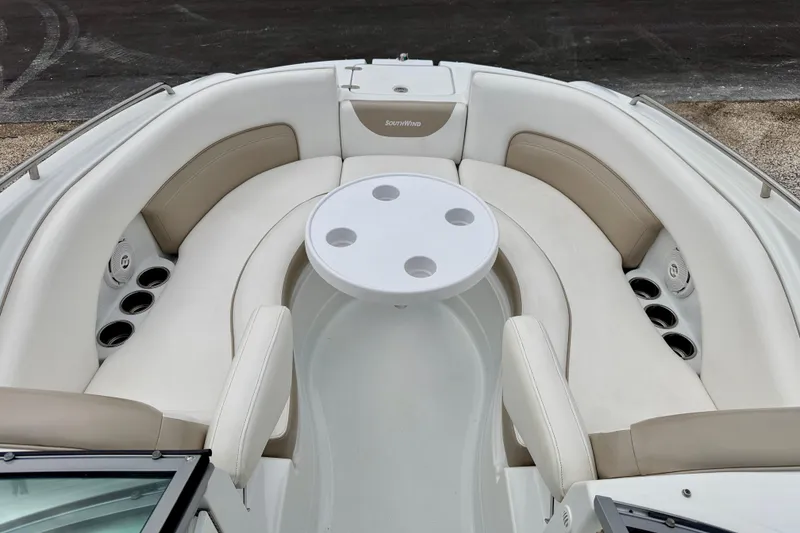 Slide: The Image of 2012 SouthWind 2600 SD boat interior with circular seating and table. - 10