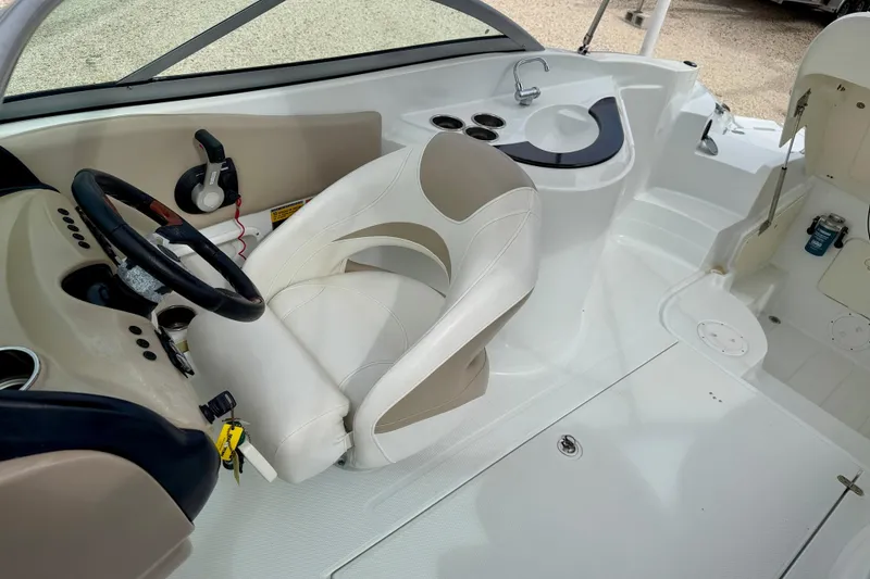 Slide: The Image of 2012 SouthWind 2600 SD boat interior with steering wheel and seating area. - 14