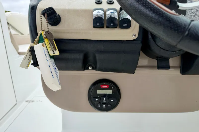 Slide: The Image of 2012 SouthWind 2600 SD boat dashboard with keys and control panel. - 17