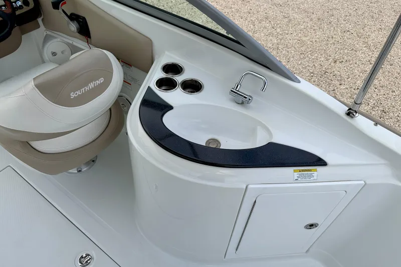 Slide: The Image of Interior of 2012 SouthWind 2600 SD boat with sink and seating area. - 19