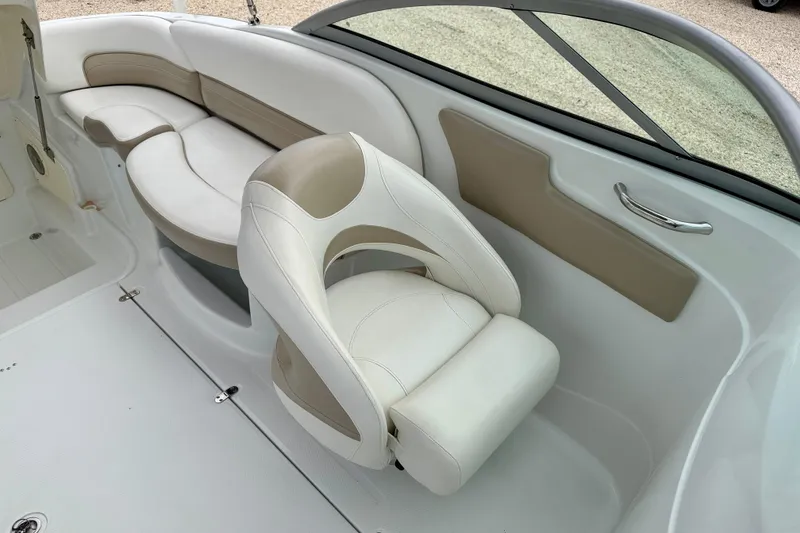 Slide: The Image of 2012 SouthWind 2600 SD boat interior with white and beige seating. - 20