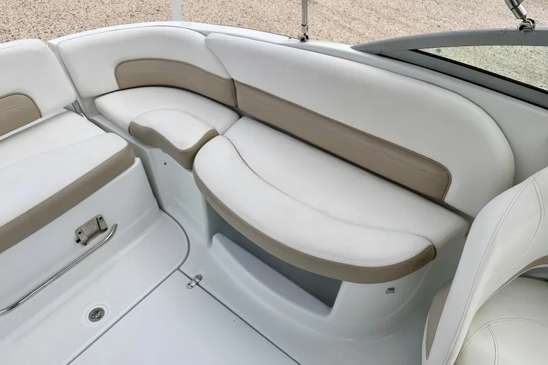 Slide: The Image of 2012 SouthWind 2600 SD boat interior with white and beige seating. - 24